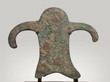 an image of a bronze statue of a man on a wooden base