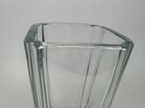 a glass vase that is sitting on a table
