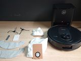a robot that is sitting on a table next to other items