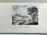an old book with a drawing of a landscape and a river