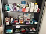a cabinet with a lot of medicine and other items on it