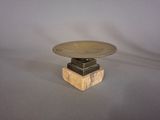 a small table with a metal plate on top of it