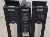 two boxes of water filters sitting on top of a counter