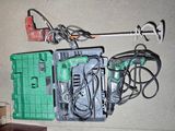 a green box with tools on it sitting on the floor