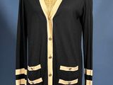 a black and white cardigan sweater on a mannequin mannequin mannequin mannequin mannequin mannequin mannequin manne