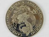 a close up of a coin with a dragon on it