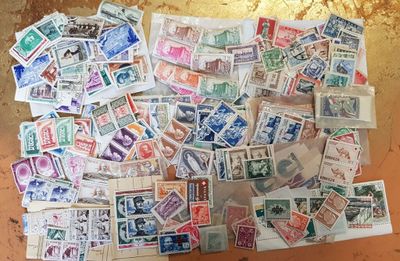 many different types of stamps on the table