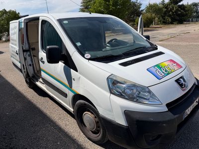 a white van that has a rainbow sticker on the side of it