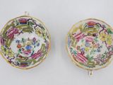 pair of chinese famille cups and saucers