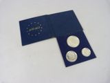 an image of a blue box with four coins in it