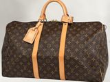 Sac Keepall Louis Vuitton en toile Monogram et cuir