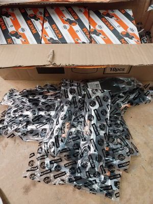 a cardboard box full of assorted items sitting on the floor