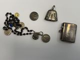 a silver lighter and a rosary with a coin