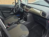 the interior of a car with the door open showing the interior of the vehicle