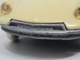 a yellow toy car that is sitting on a table