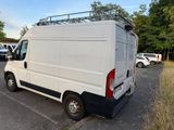 a white van that is parked in a parking lot