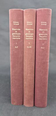 three pink books sitting on top of a table next to each other