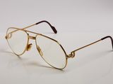 a close up of a pair of glasses on a white surface