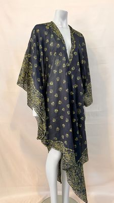 an image of a mannequin mannequin wearing a black and gold dress
