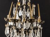 an image of a crystal chandelier hanging from a black wall