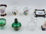 a lot of glass items that are on the table