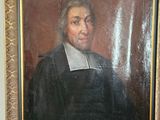 a painting of a man sitting on a couch next to a framed picture