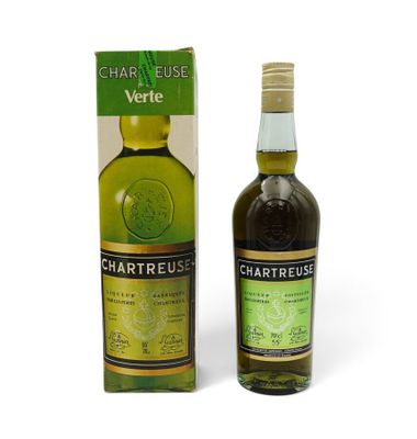 the bottle of chartreusus is next to the box of the bottle