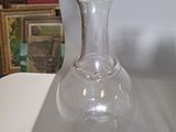 two wine glasses sitting on a table next to each other
