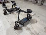 a scooter that is sitting on the floor in the garage
