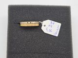 a ring with a price tag on it sitting on a piece of cloth