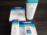 deux tubes de gel hydroalcoolique Urgo et un tube de gel hydroalcoolique Urgo posés sur une table