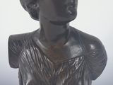 statue of a woman in a dress on a pedestal