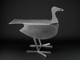an image of a metal sculpture of a duck