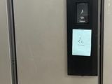 three refrigerators are lined up in a row with labels on them