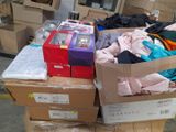 boxes of clothing are stacked on top of each other in a warehouse