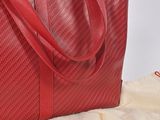 an image of a red bag sitting on top of a white bag