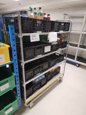 a large rack with many bottles and containers on it