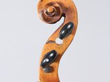 a close up of a violin with a wooden bow on a white background