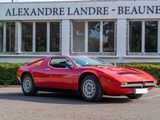 a red sports car parked in front of a building