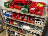 many bins of assorted items on a shelf