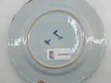 a plate with a blue and white design on it