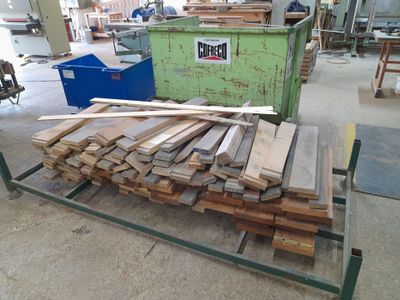 many pieces of wood on a cart in the warehouse