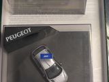 a box with a toy car and a cell phone in it