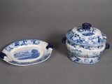 pair of blue and white dishes with lids and handles
