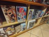 a lot of anime books on the shelves in the store
