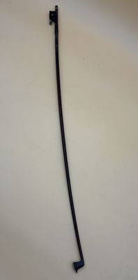 a black handle on a white plate on a table