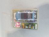 a small toy car in a plastic box on a table