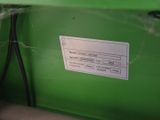 a picture of a green machine with a label on it