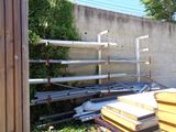 a pile of pipes and pipes sitting in the grass