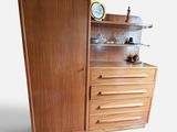an image of a wooden cabinet with a clock on top of it